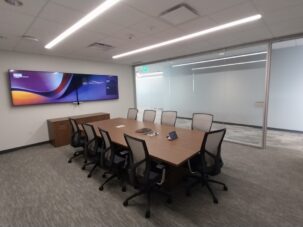 Meeting room entry with STC 30 doors for improved privacy