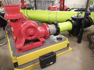 Un-isolated pipe support allowing vibration noise in executive suite below