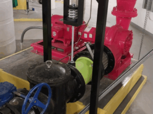 Recommended and installed pipe support trapeze with spring hanger